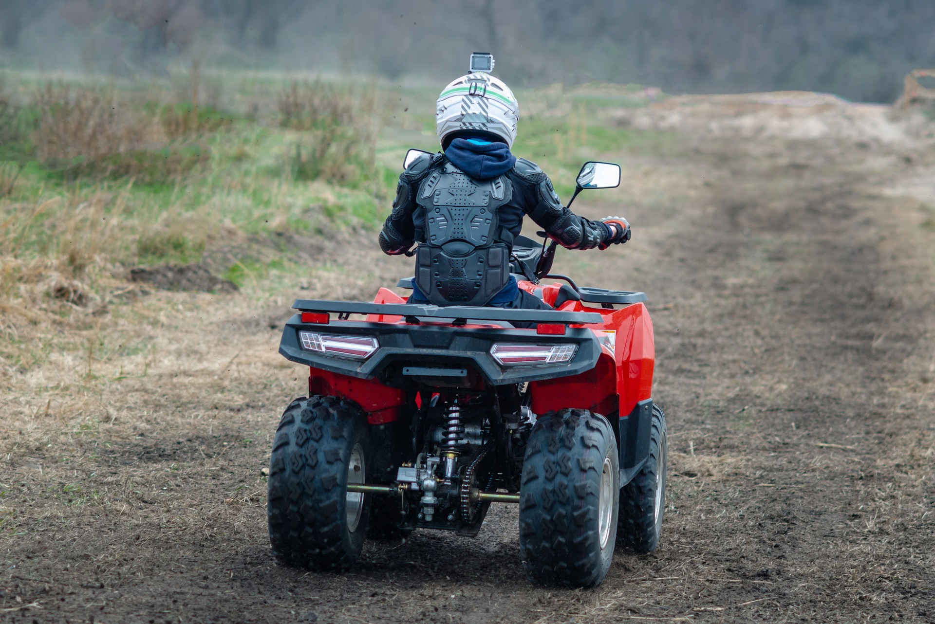 Buggy moves on a dusty road in autumn Buggy moves on a dusty road in autumn